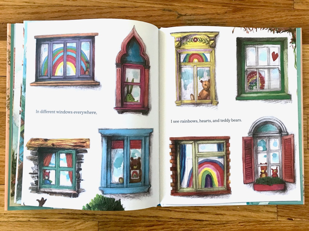 Spread full of 8 windows of different sizes and colors with rainbows and/or bears in them.